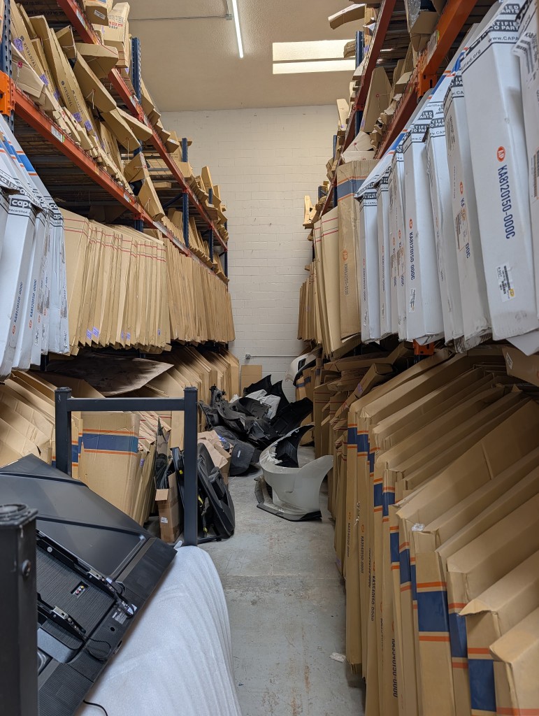Warehouse shelving filled with parts inventory